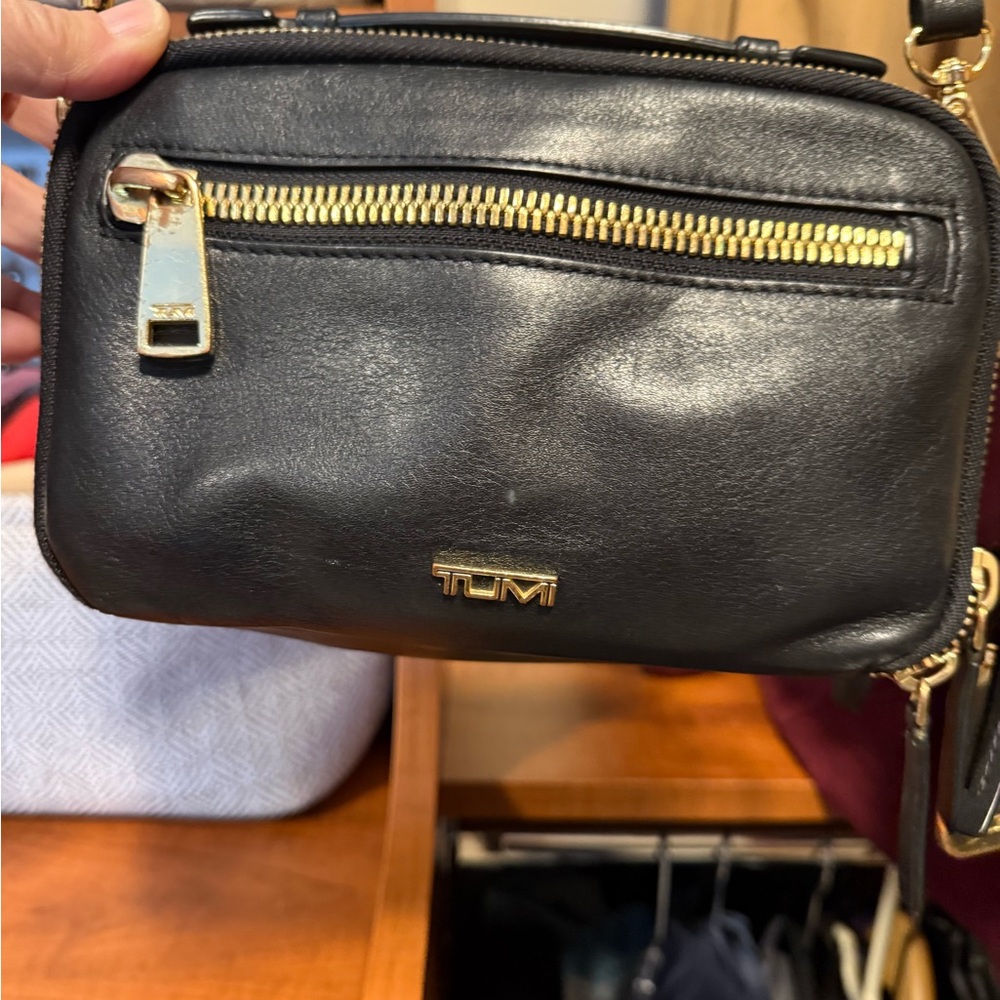 TUMI Black Leather Crossbody with Gold Hardware Accents